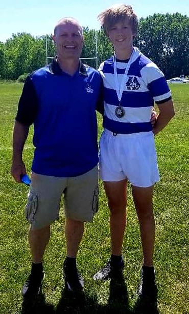 Chad with a young rugby player